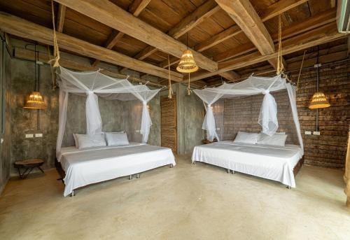 Postel nebo postele na pokoji v ubytování CasaCoral Hotel