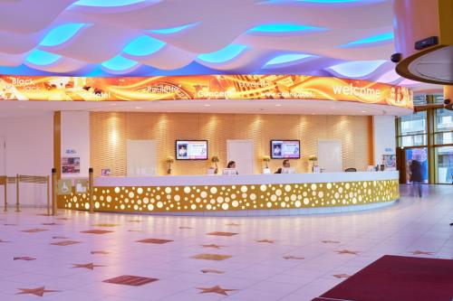 a lobby with a bar in a shopping mall at Casino 2000 - Adult Guests Only in Mondorf-les-Bains