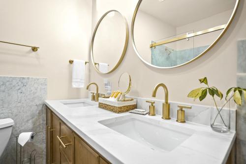 a bathroom with two sinks and a mirror at The Mary Anne Boutique Hotel USVI in Charlotte Amalie