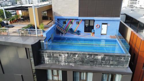 a swimming pool on the side of a building at Best Western Click Sathorn 11 Bangkok in Bangkok