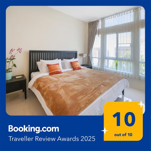 a bedroom with a bed and a large window at Phuket 3-Bedrooms Private Family Villa 220M2 Swimming Pool and Gym-Fitness in Thalang