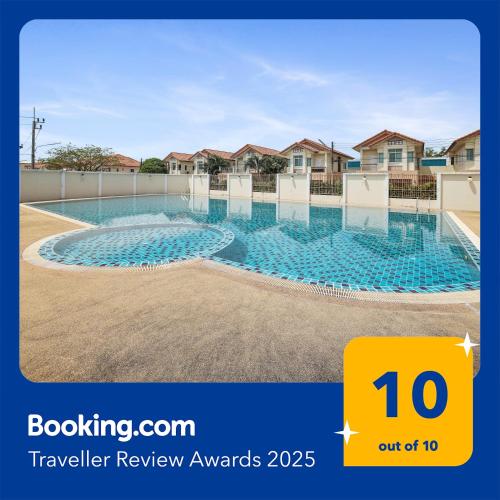 a large swimming pool at a residential property at Spacious Family Garden Villa - Huge Pool & Gym Access in Thalang
