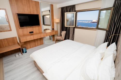 Voodi või voodid majutusasutuse Marhaba Plaza Hotel toas