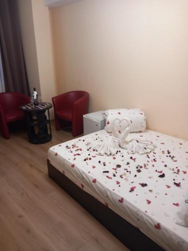 Postel nebo postele na pokoji v ubytování Стаи за гости - Цветето на Ангела