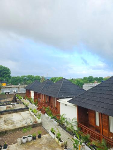an overhead view of a row of houses with roofs at Amore Komodo in Labuan Bajo