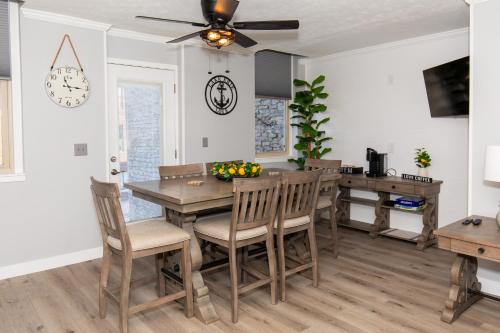 a dining room with a table and chairs at NEW! Remodeled & Upgraded Vacation Apartment in Sandusky