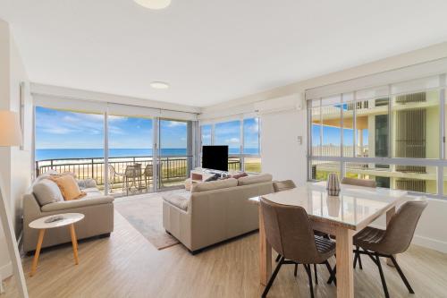 a living room with a view of the ocean at Oceanside Resort - Absolute Beachfront Apartments in Gold Coast