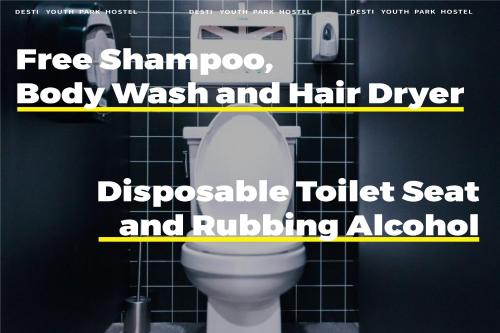 a white toilet in a bathroom with the words free shampoo body wash and hair at Xi'an Desti Youth Park Hostel Bell & Drum Tower in Xi'an