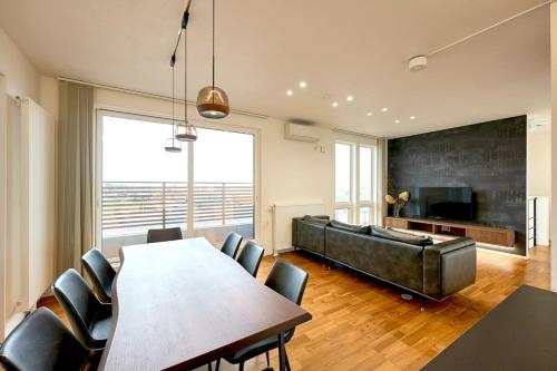 a living room with a table and a couch at furano frame in Furano