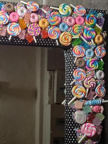 a bunch of lollipops on a wall at Appartement gourmand in Sisteron