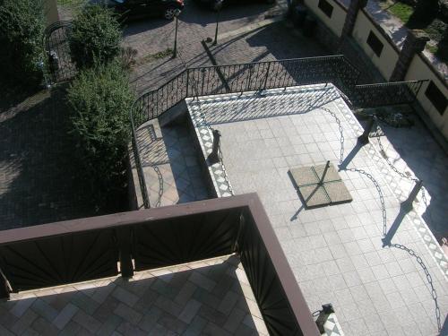 an overhead view of a patio with a tennis court at Balatoni Panoráma Villa in Balatonalmádi