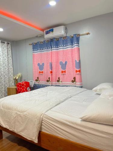 Katil atau katil-katil dalam bilik di Malapascua Island Dos Marias Tourist Inn