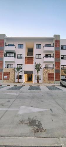 an empty parking lot in front of a building at Condo located 8 min from DT & 15 min from Airport in San José del Cabo