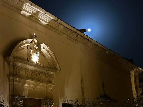 a building with a moon on top of it at Arcate Barocche - Urban Lofts - Scicli in Scicli