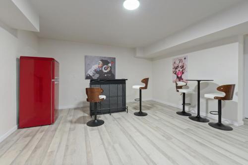 a room with chairs and paintings on the wall at Luxury Family Villa Sleeps 20 in Coarsegold