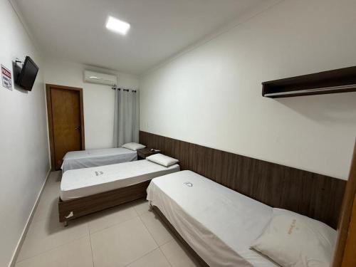 Postel nebo postele na pokoji v ubytování Hotel Nova Jerusalém