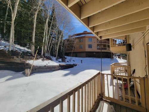 a balcony of a house with snow on the ground at Cozy Retreat with Scenic Views- Prestige Vacations in Brian Head