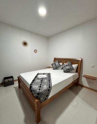 Llit o llits en una habitació de Apartamento Ilhas