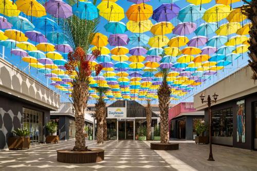 a bunch of umbrellas hanging from a ceiling at Days Inn by Wyndham Alanya in Alanya