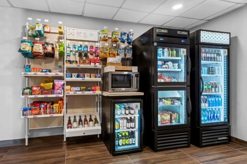 a grocery store with a refrigerator and a microwave at Spark By Hilton Bensalem Philadelphia in Bensalem