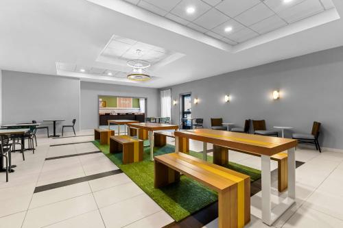 an empty waiting room with tables and chairs at Spark By Hilton Bensalem Philadelphia in Bensalem