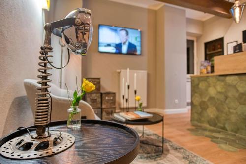 a microphone on a table in a living room at Vienna House Easy by Wyndham Ingolstadt in Ingolstadt