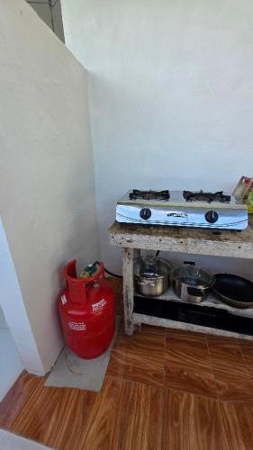 a kitchen with a stove and some pots and pans at Villa Juan y Exequila in Anda
