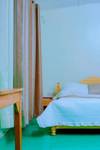 Ένα ή περισσότερα κρεβάτια σε δωμάτιο στο Quality Inn Motel Nyanza