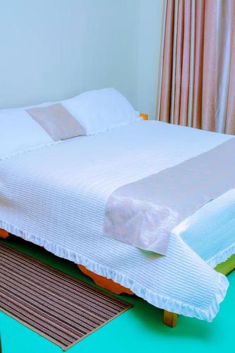Ένα ή περισσότερα κρεβάτια σε δωμάτιο στο Quality Inn Motel Nyanza