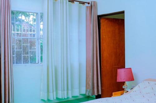 Ένα ή περισσότερα κρεβάτια σε δωμάτιο στο Quality Inn Motel Nyanza