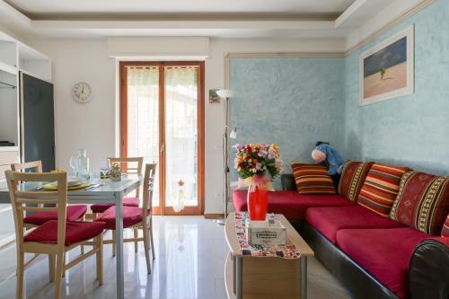 a living room with a couch and a table at Casa Norb Lerici - with Private Parking in Lerici