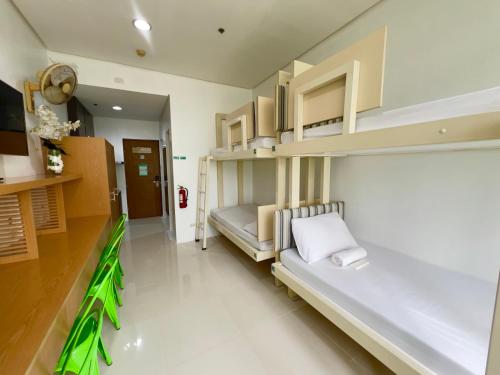 Ένα ή περισσότερα κρεβάτια σε δωμάτιο στο UPad Taft