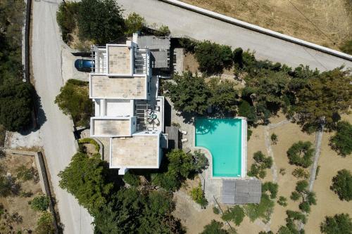 an aerial view of a house with a swimming pool at Villa Padma, Agkeria Paros in Angairiá