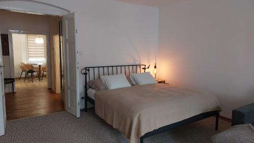 Posteľ alebo postele v izbe v ubytovaní Apartman Široká