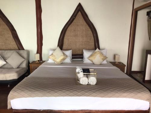 Postel nebo postele na pokoji v ubytování Dusit Buncha Koh Tao by Riya Group