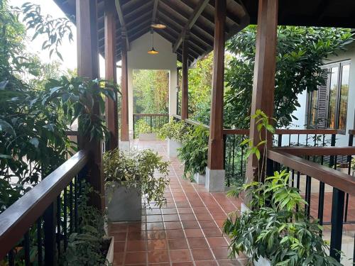 a porch of a house with plants on it at Birders Urban Retreat in Sri Jayewardenepura Kotte