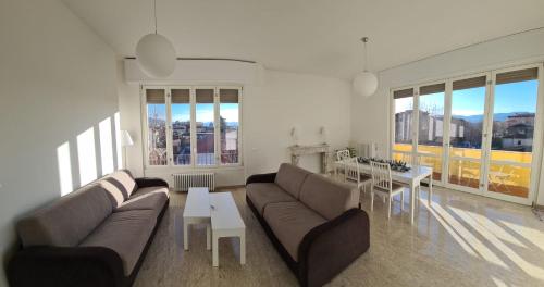 a living room with a couch and a table at Attico 101 in Pistoia