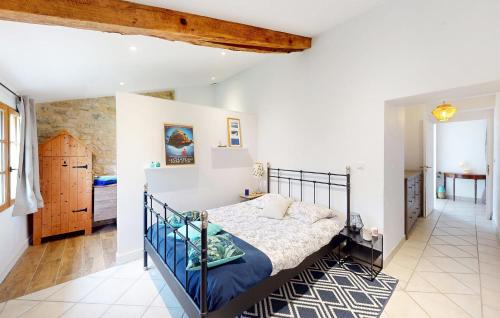 a bedroom with a bed in a room at Nice Home In Saint-Géraud-De-Corps in Saint-Géraud-de-Corps