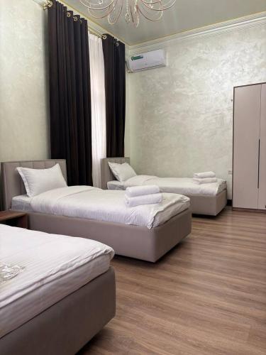 Katil atau katil-katil dalam bilik di Mehmon Hotel OK