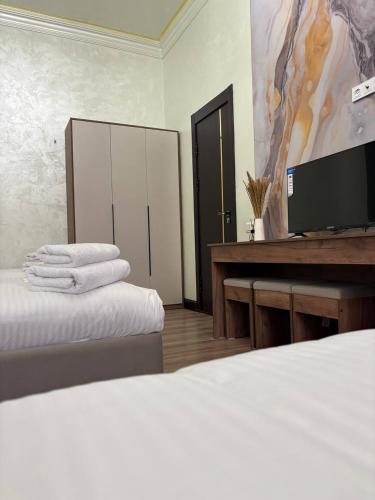 Katil atau katil-katil dalam bilik di Mehmon Hotel OK