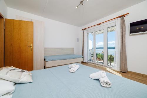 Posteľ alebo postele v izbe v ubytovaní Apartments MAJA