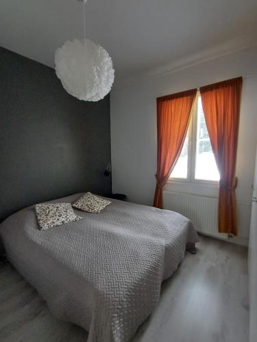 a bedroom with a bed and a large window at Royal Katariina in Kokkola