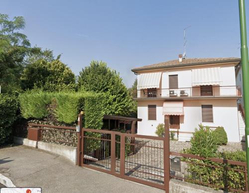 a house with a fence in front of it at PeschieraView Apartment 1st floor x4 in Peschiera del Garda