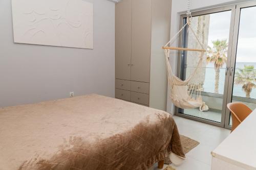 Ένα ή περισσότερα κρεβάτια σε δωμάτιο στο Eftihia Apartments by the sea