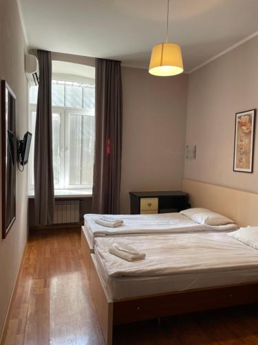 Postel nebo postele na pokoji v ubytování Hotel Tasty Tbilisi