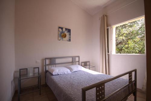 מיטה או מיטות בחדר ב-Camping Mozziconaccio