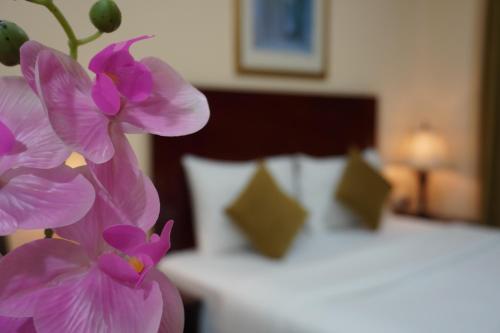 Katil atau katil-katil dalam bilik di Onyx Hotel Apartments - MAHA HOSPITALITY GROUP