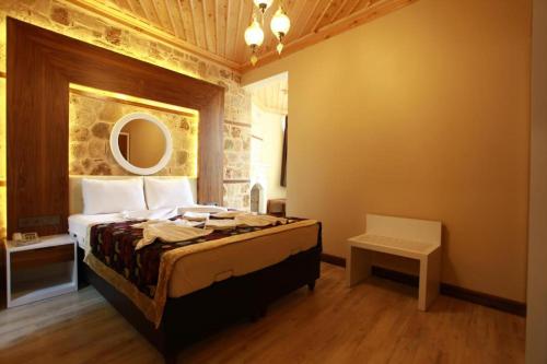 a bedroom with a large bed in a room at Bacchus Pension in Antalya
