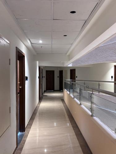 a corridor of an empty building with a hallway at Elegant Escape , the complete home in Pune