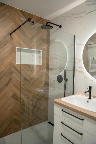 a bathroom with a shower and a sink at Apartmán DANIEL in Spišská Nová Ves